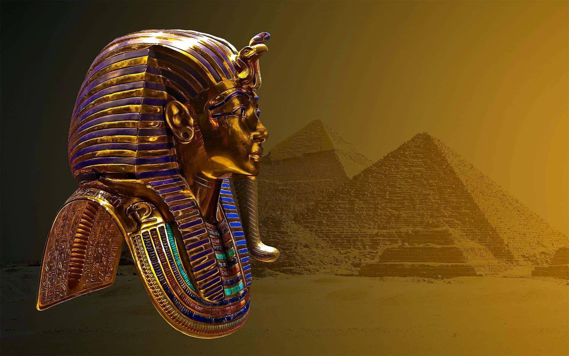 A Golden Egyptian Mask Is Shown In Front Of The Pyramids