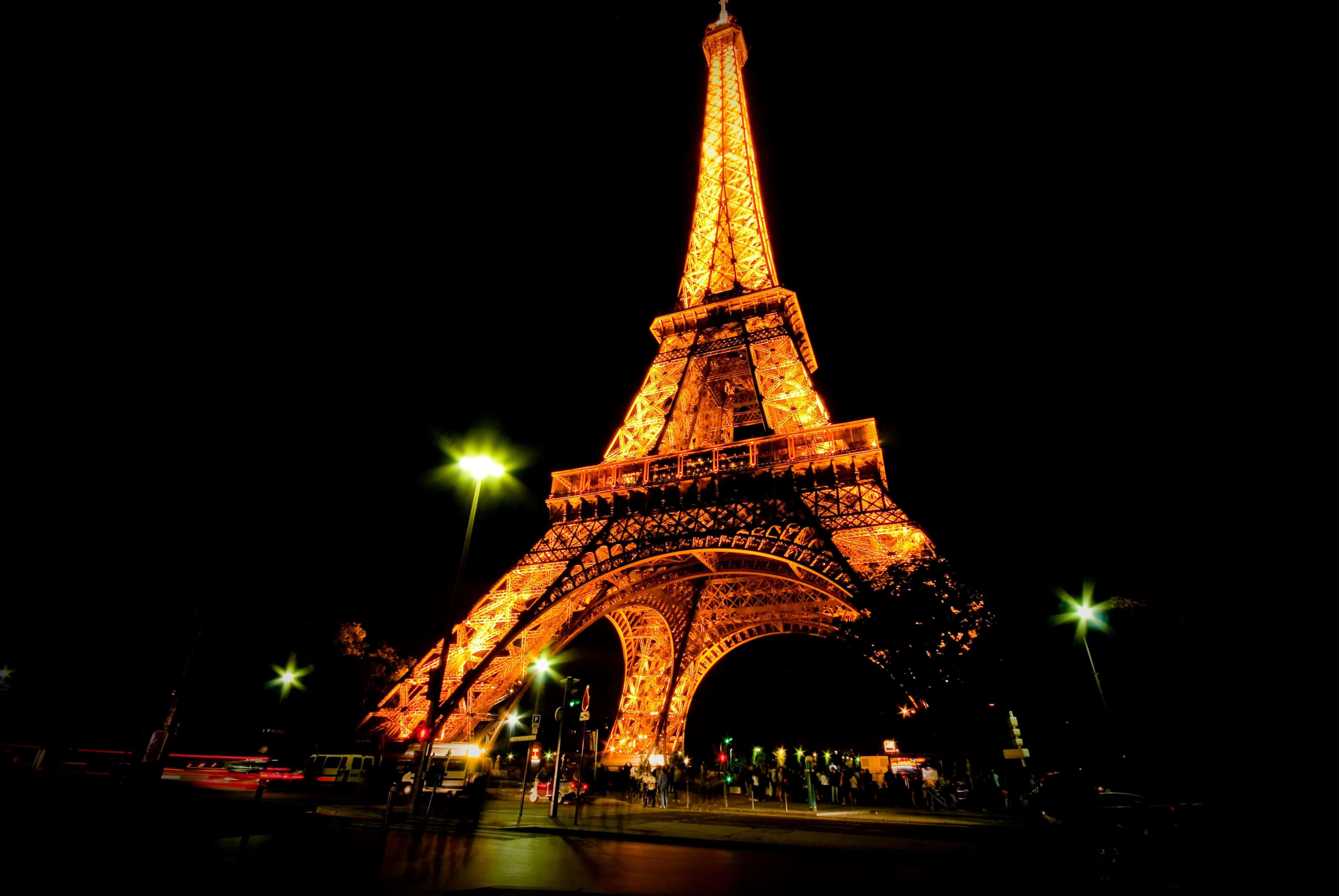 The Eiffel Tower lights up the night sky in the City of Lights.