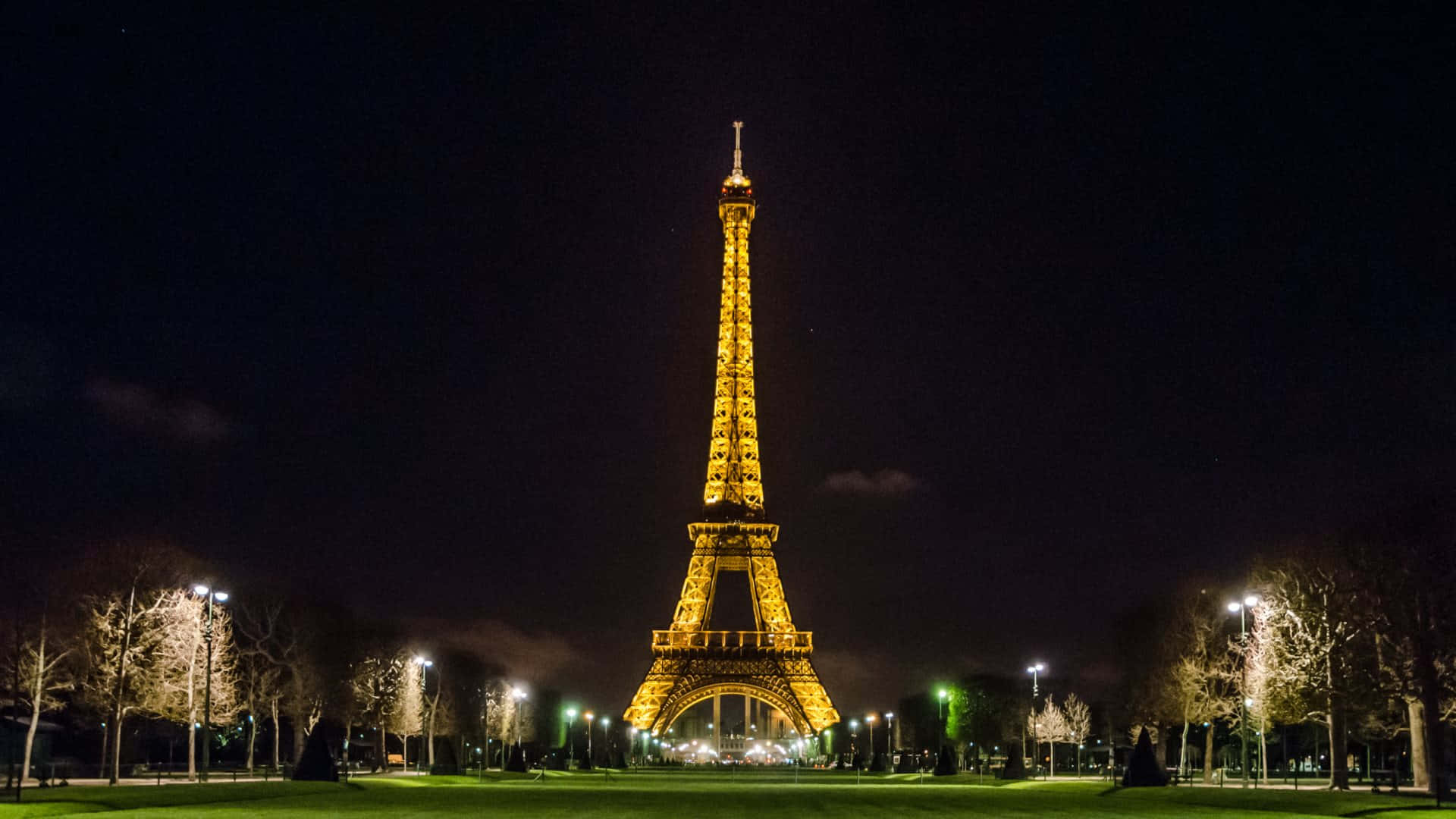 The majestic Eiffel Tower illuminated at night in Paris, France.