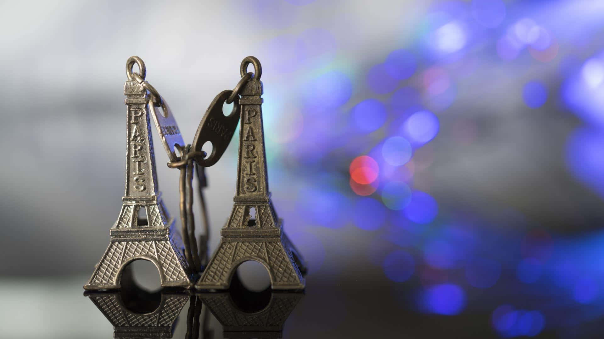 The Eiffel Tower lights up the Paris Sky
