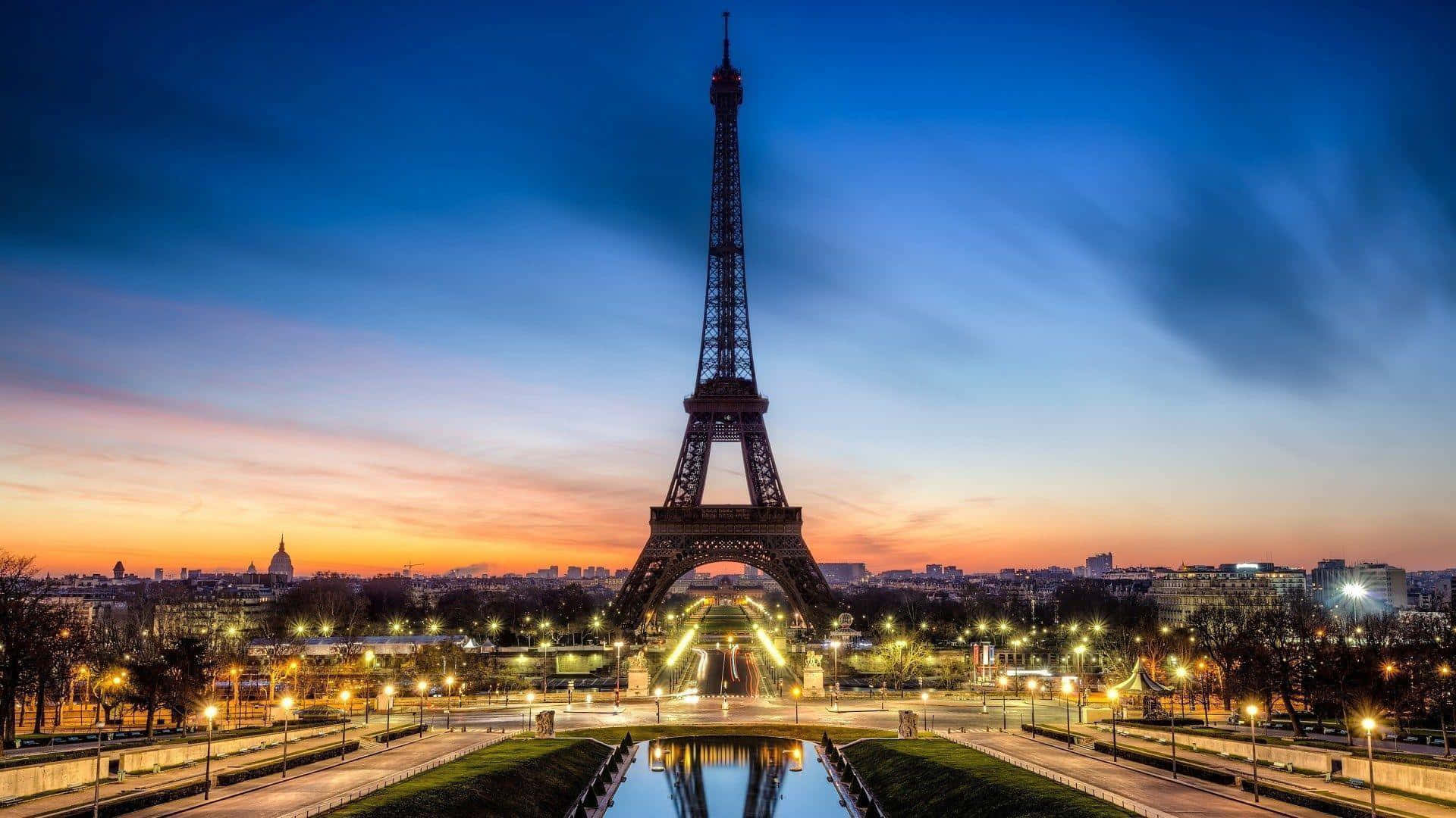 An iconic view of the Eiffel Tower against a clear sky.