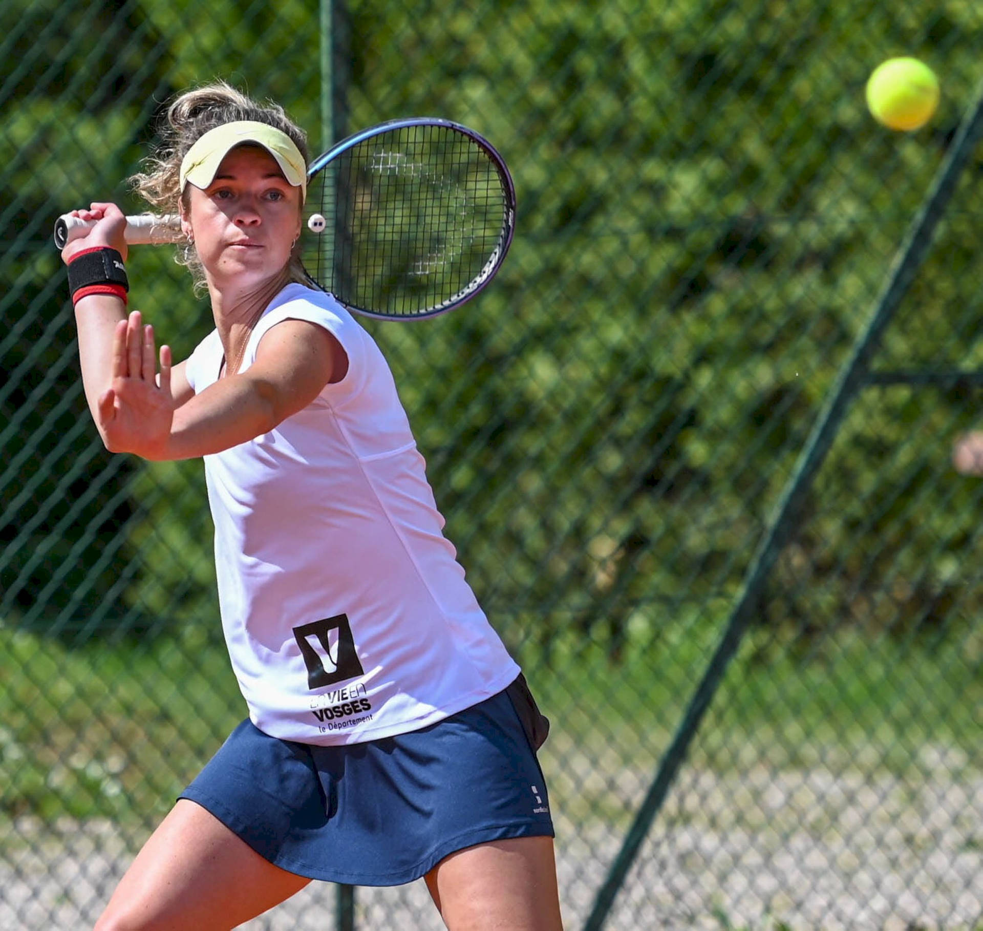 Professional Tennis Player Ekaterina Makarova in Action Wallpaper