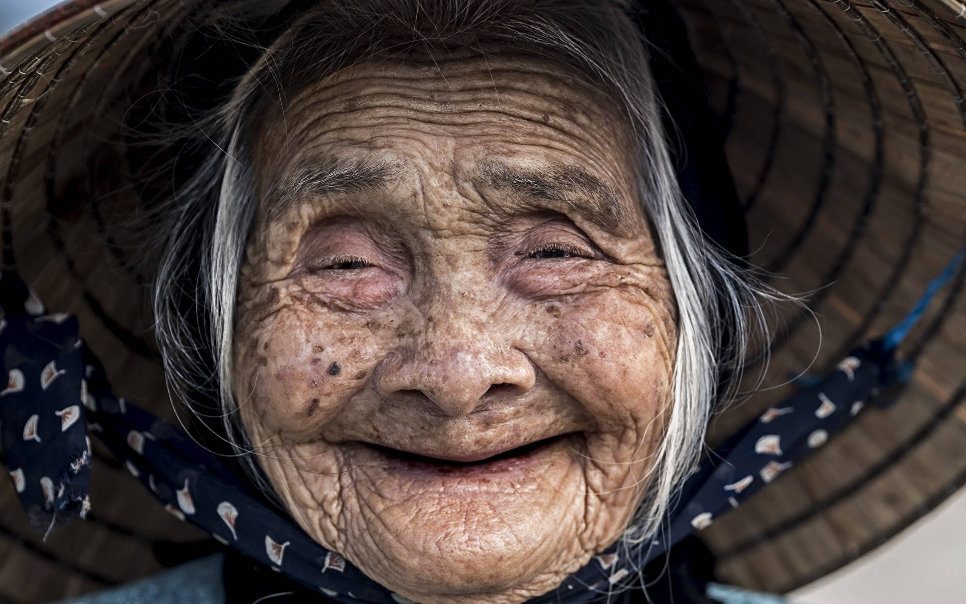 Elderly Woman Beaming Smile Wallpaper