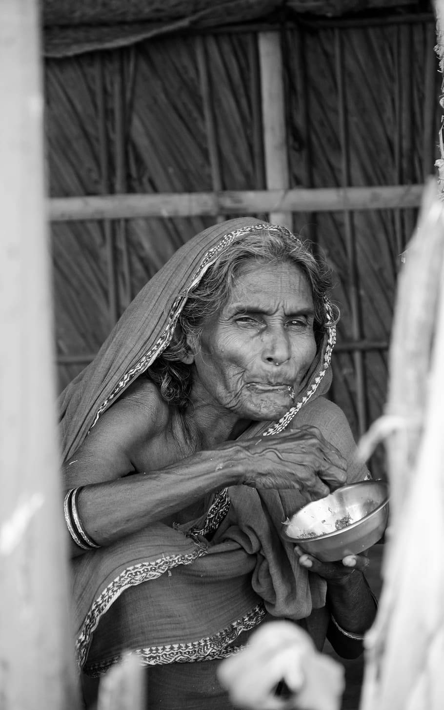 An elderly woman enjoying a peaceful meal Wallpaper