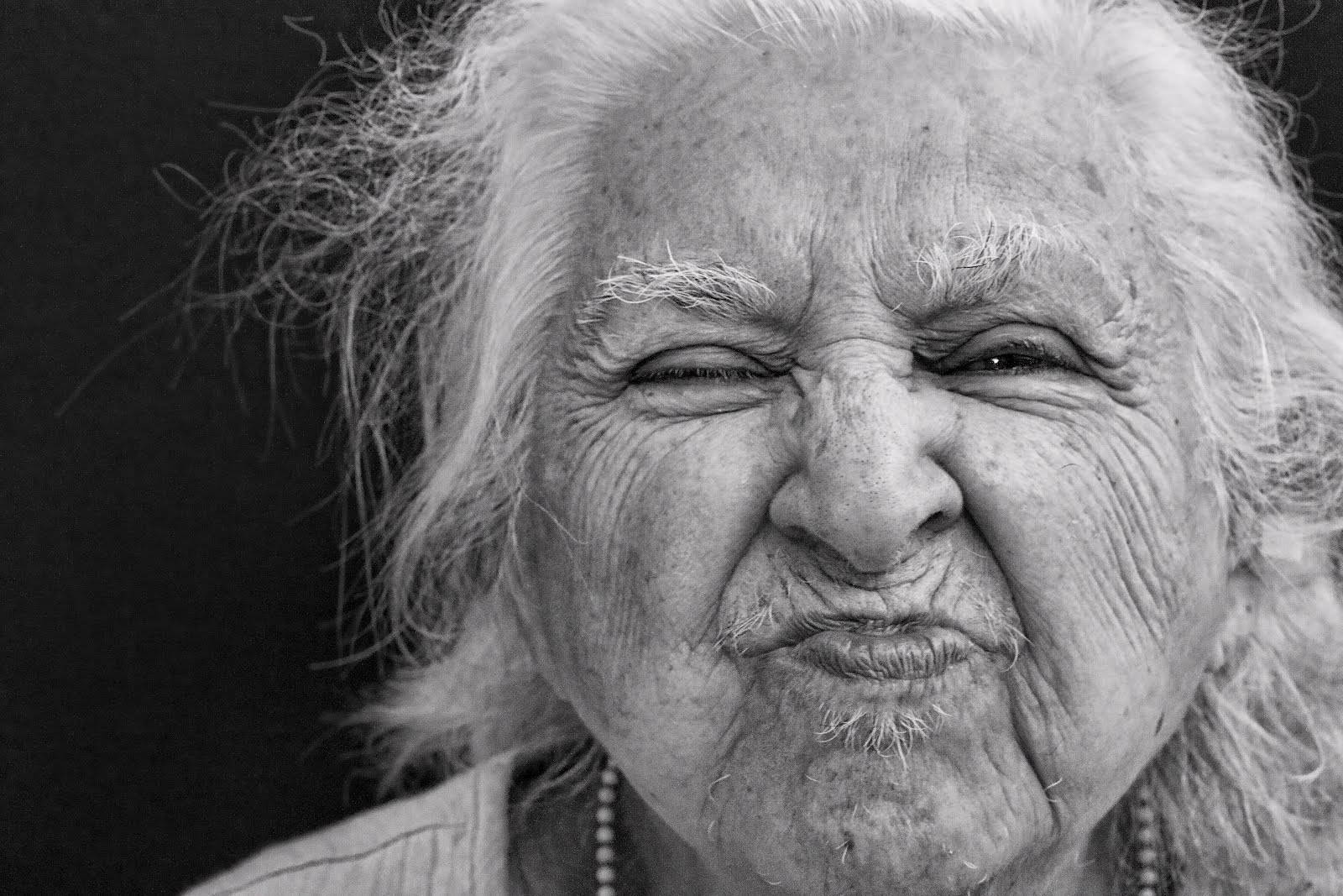 Elderly Woman Face Expression Wallpaper
