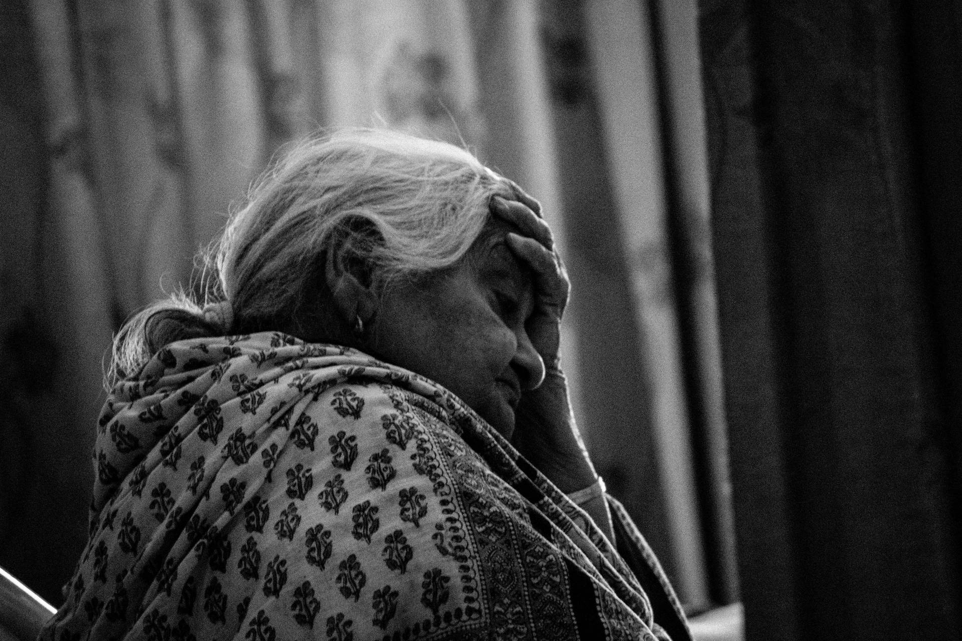 Elderly Woman In Distressed Wallpaper