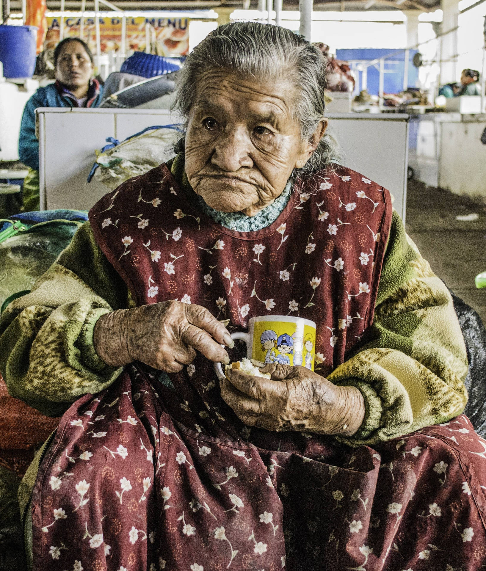 Elderly Woman In Market Background