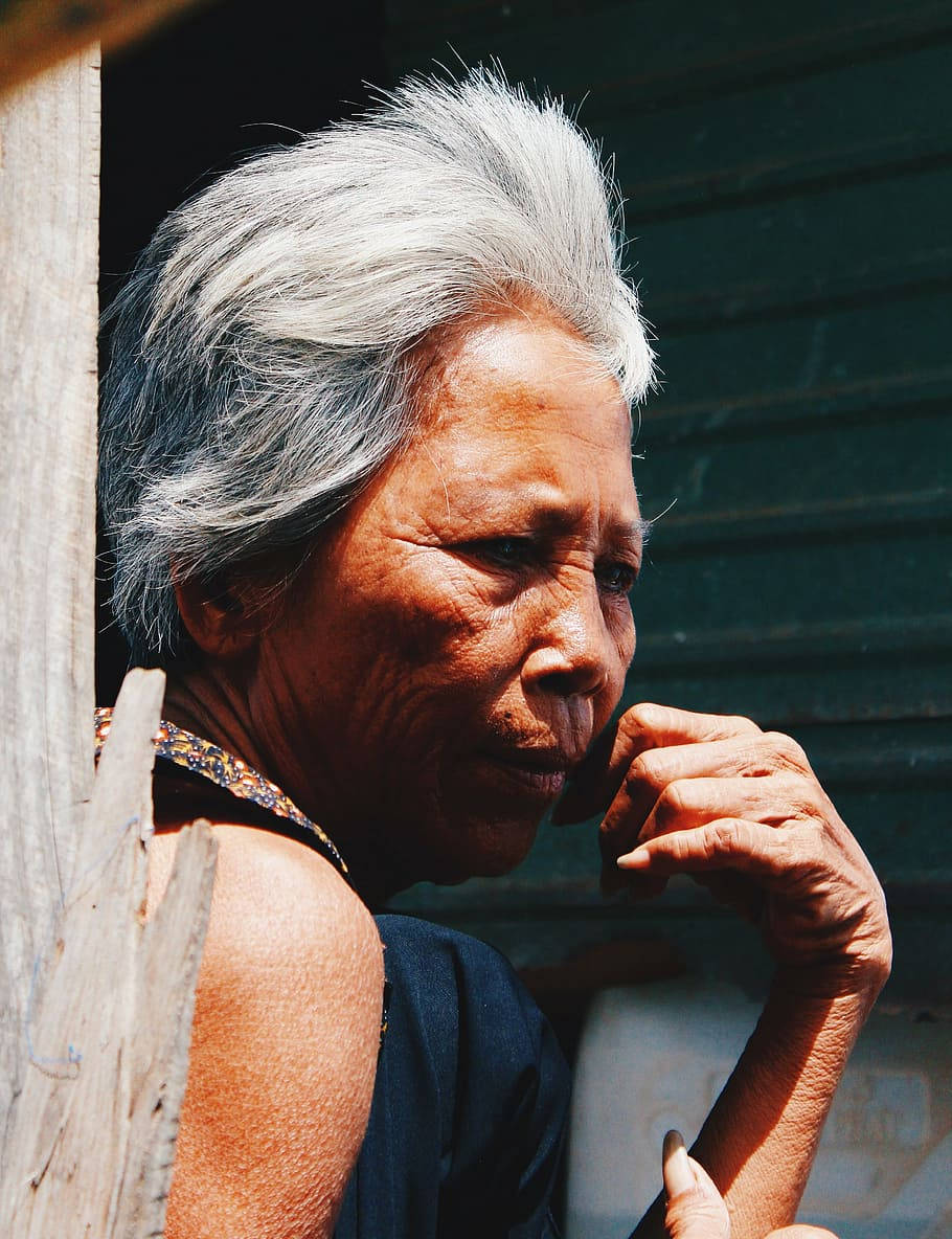 Elderly Woman In Sunny Day Wallpaper