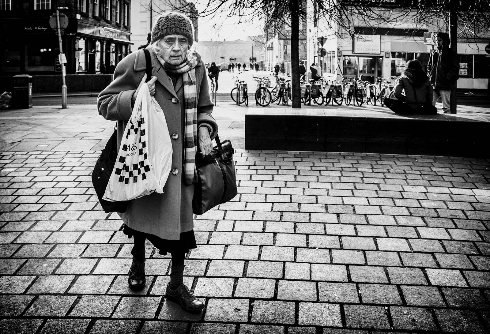 Elderly Woman In The Street Background