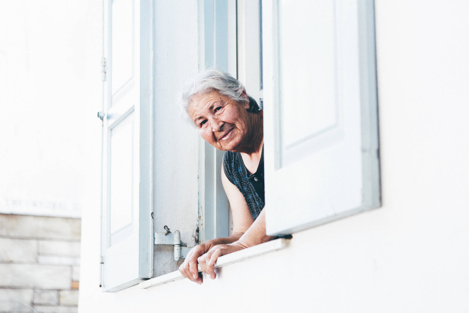 Elderly Woman In The Window Background