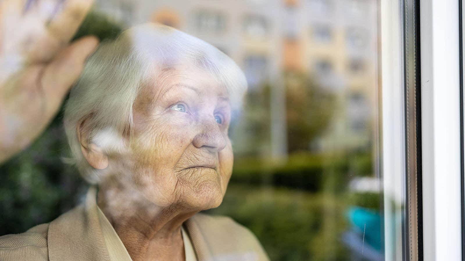 Elderly Woman Through The Glass Wallpaper