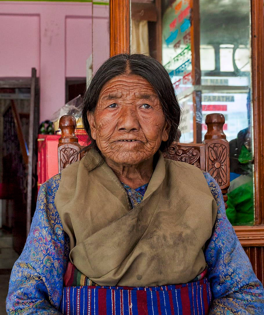Elderly Woman Traditional Blue Dress Wallpaper
