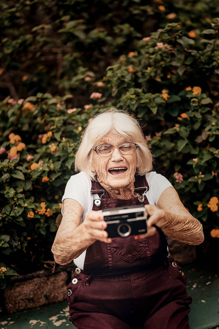 Elderly Woman With Camera Wallpaper