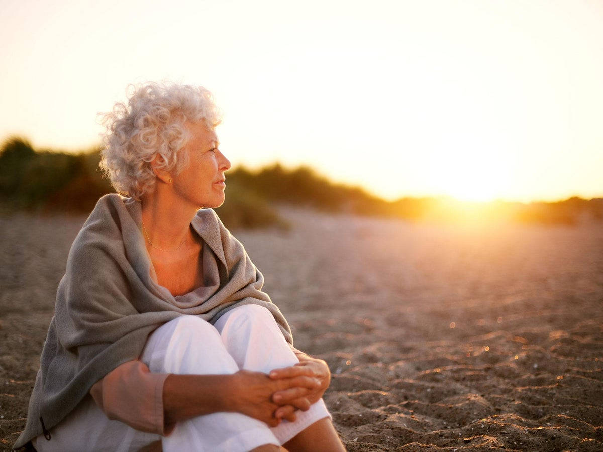 Elderly Woman With Sunset Wallpaper