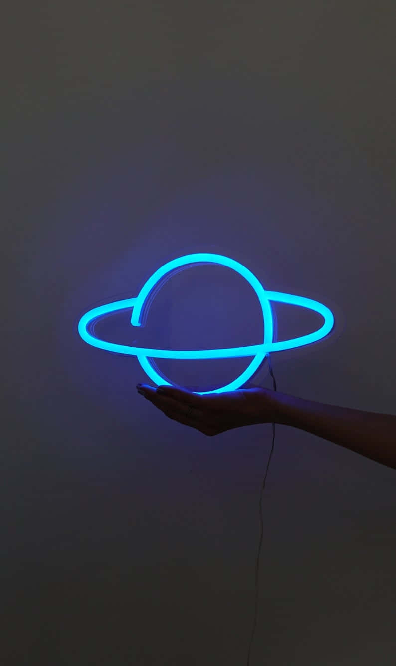 Electric Blue Neon Planet Floatingon Hand Wallpaper