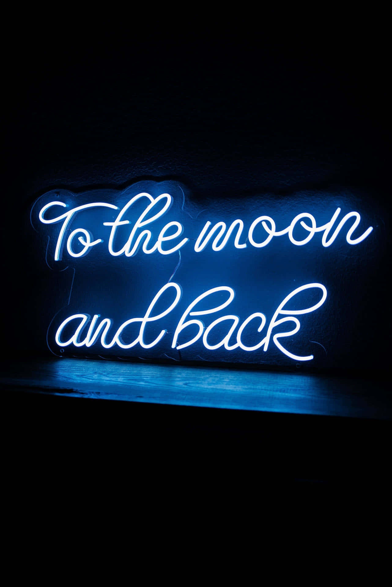 Electric Blue Neon Sign To The Moon And Back Wallpaper