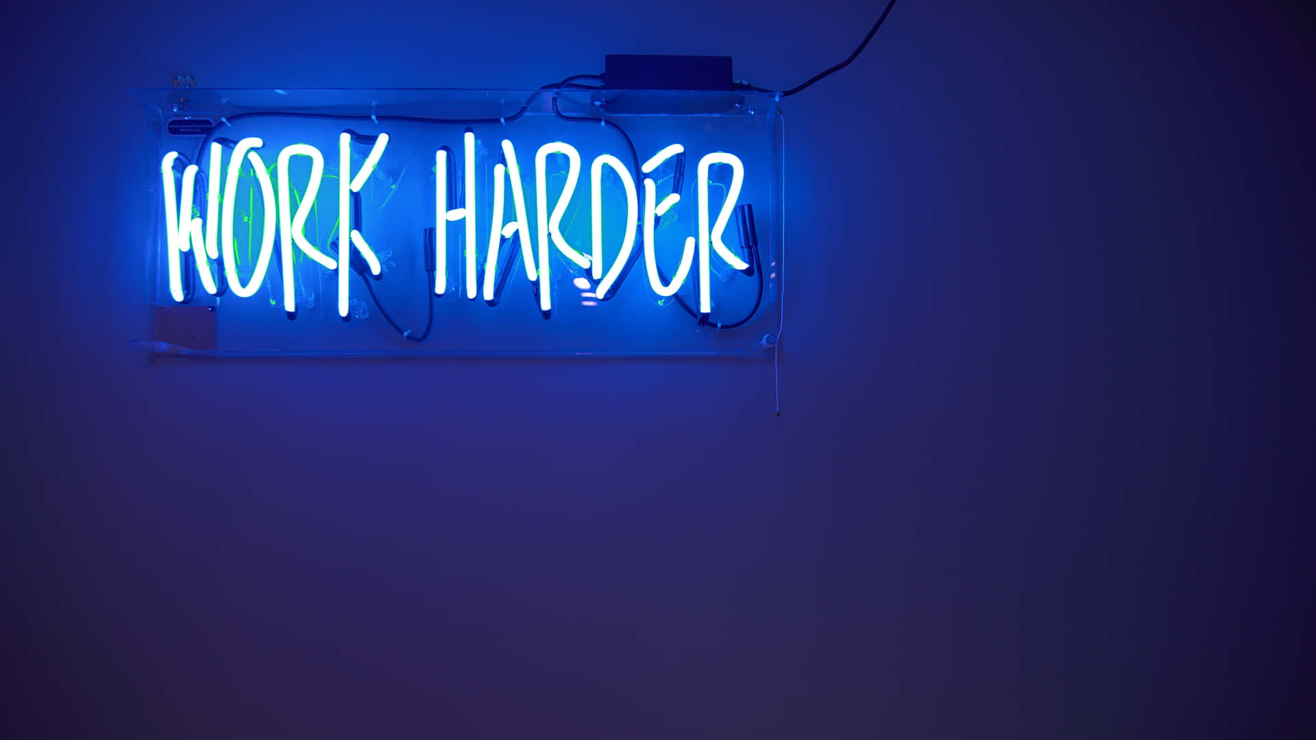 Electric Blue Neon Sign Work Harder Wallpaper