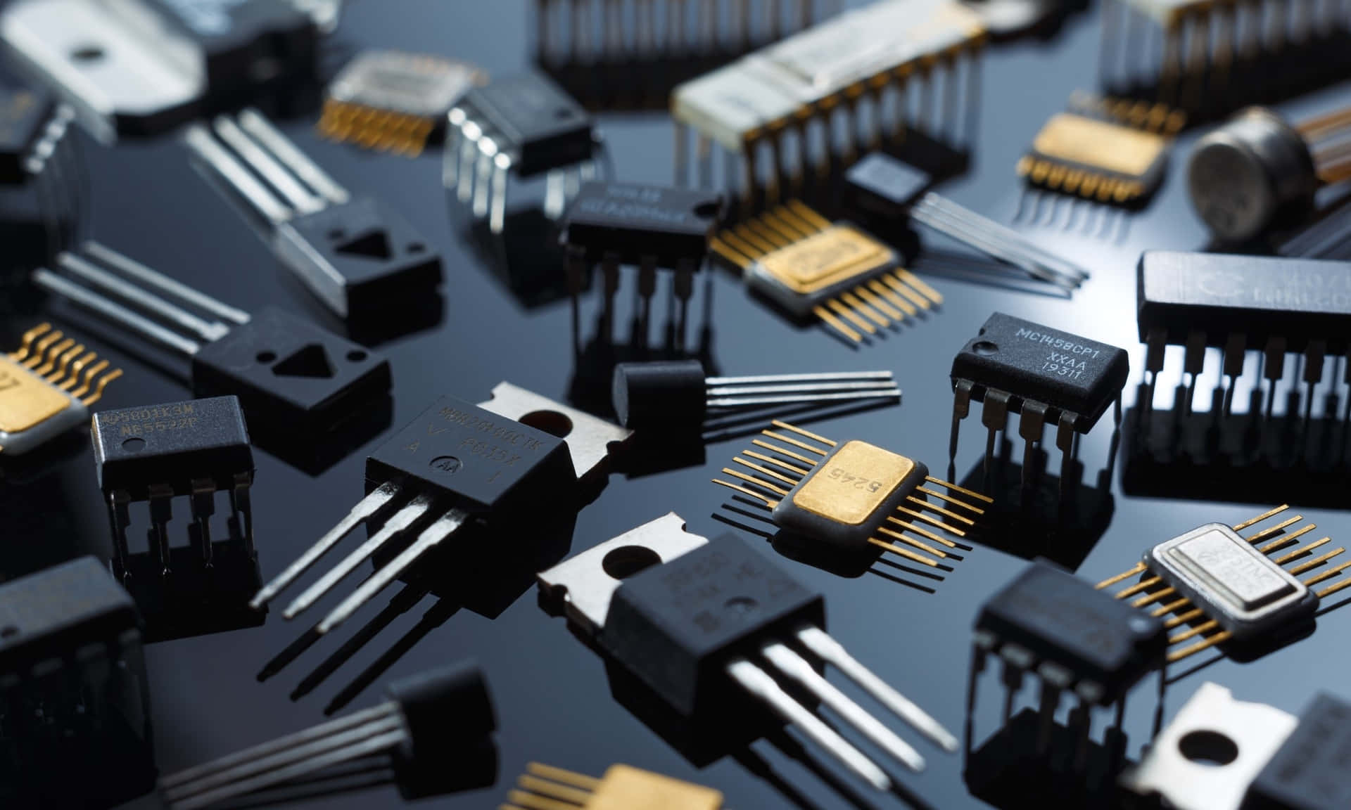 Various Electronic Components on Green Circuit Board Wallpaper