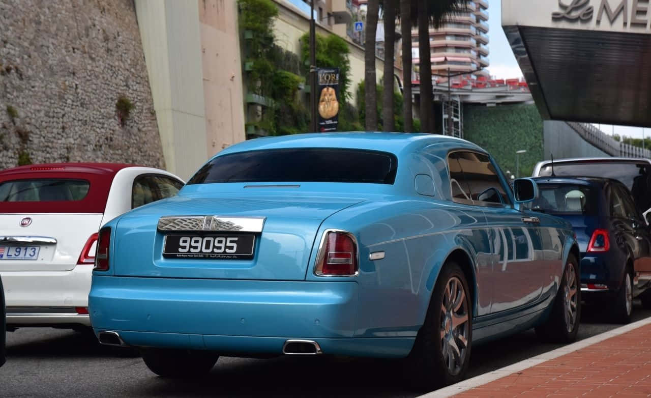 Elegance Embodied In Motion: The Rolls-royce Phantom Drophead Coupe Wallpaper