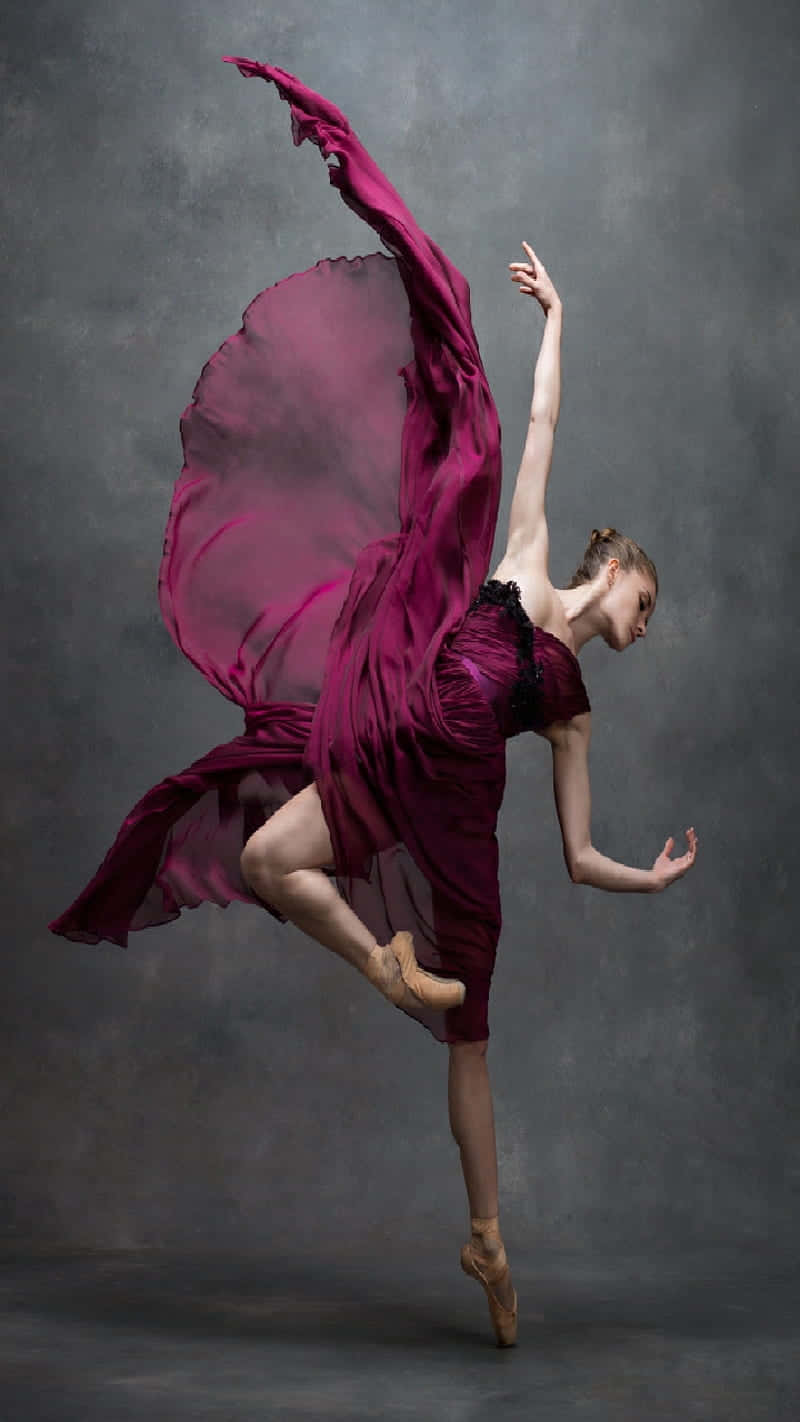 Elegant_ Ballet_ Dancer_in_ Burgundy_ Dress.jpg Wallpaper