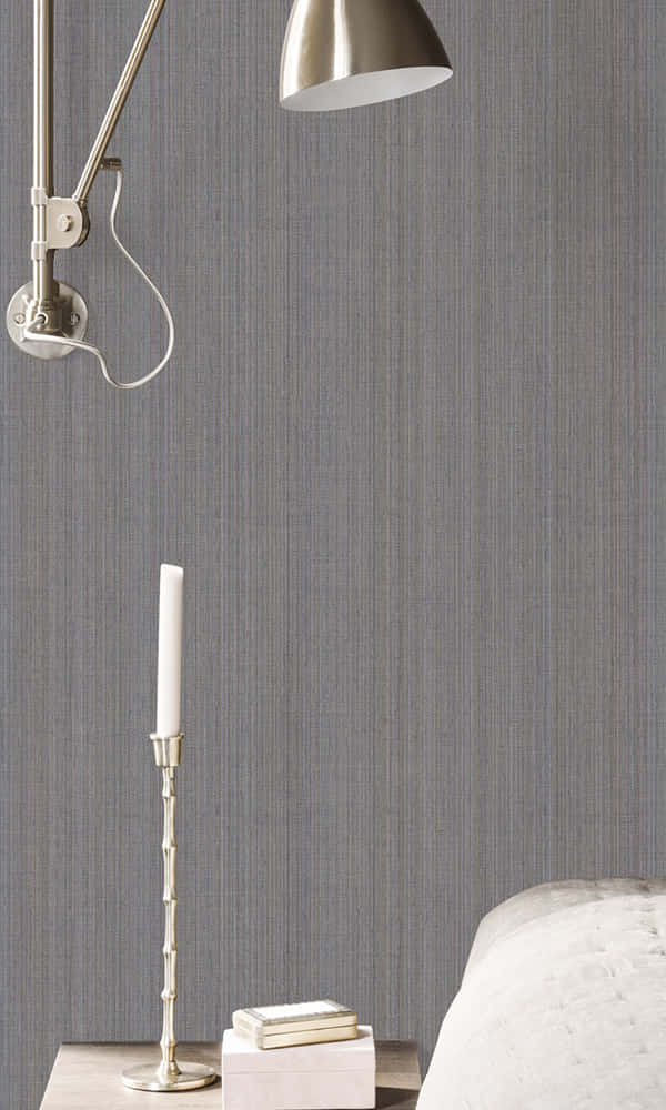Elegant Bedside Setupwith Wall Lamp Wallpaper