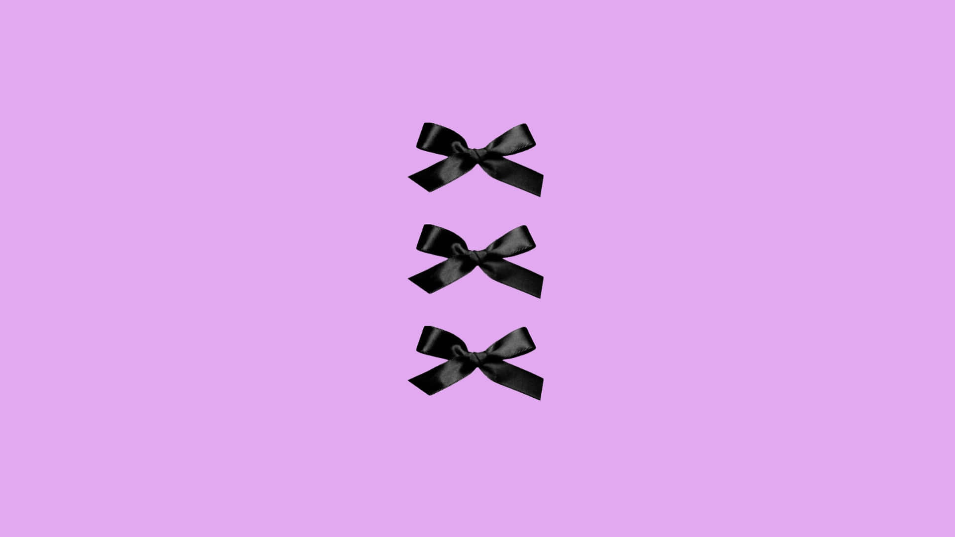 Elegant Black Bow Trio Wallpaper