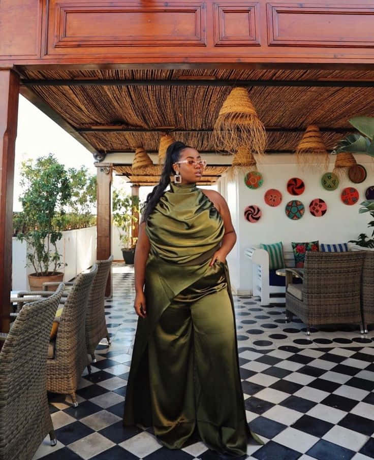 Elegant Black Womanin Green Gown Luxury Setting.jpg Wallpaper
