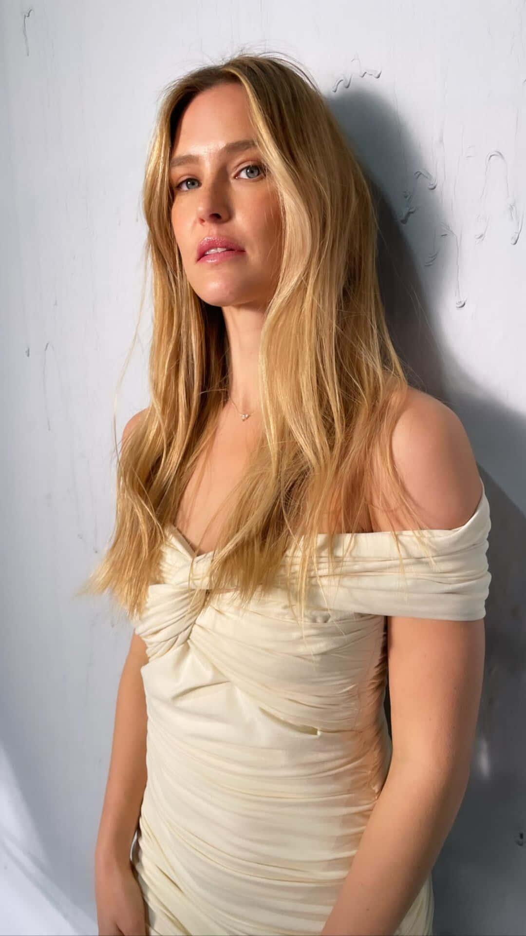 Elegant Blonde Womanin White Dress Wallpaper