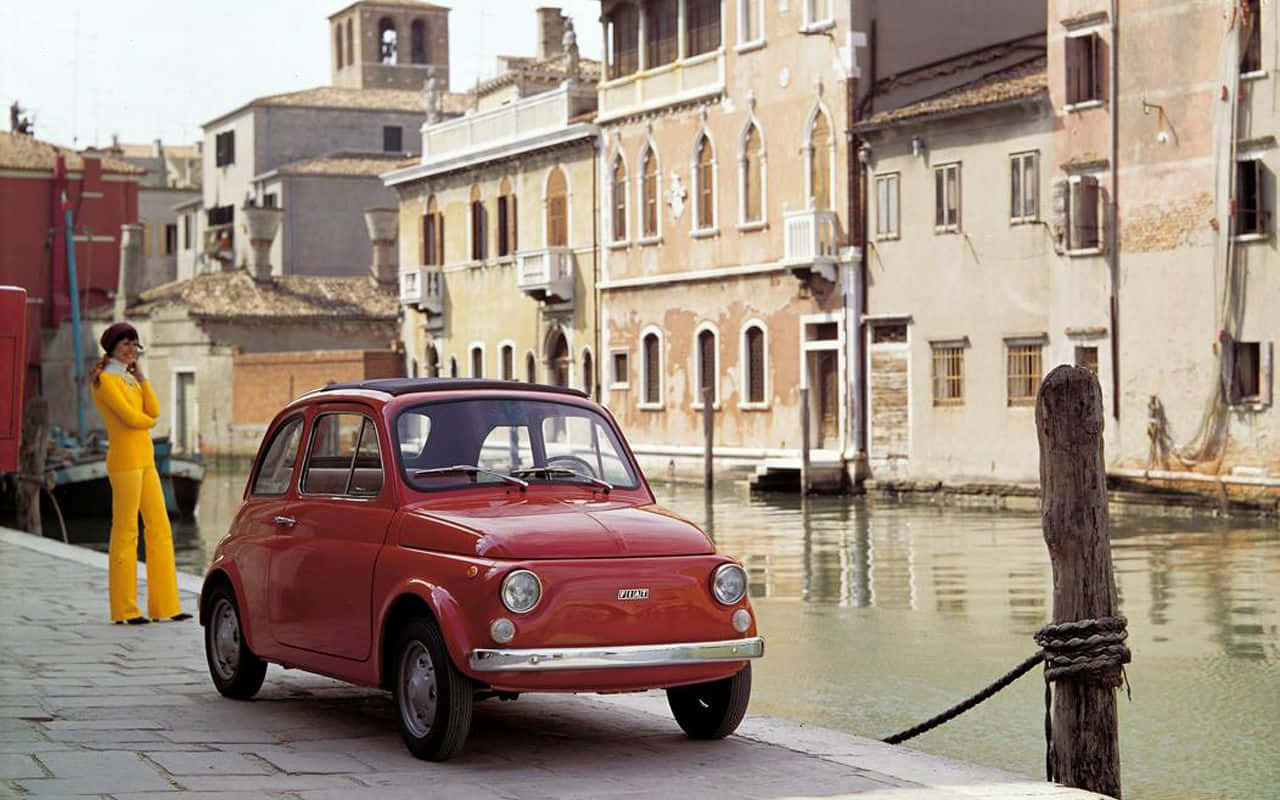 Elegant Fiat Cinquecento On Open Road Wallpaper