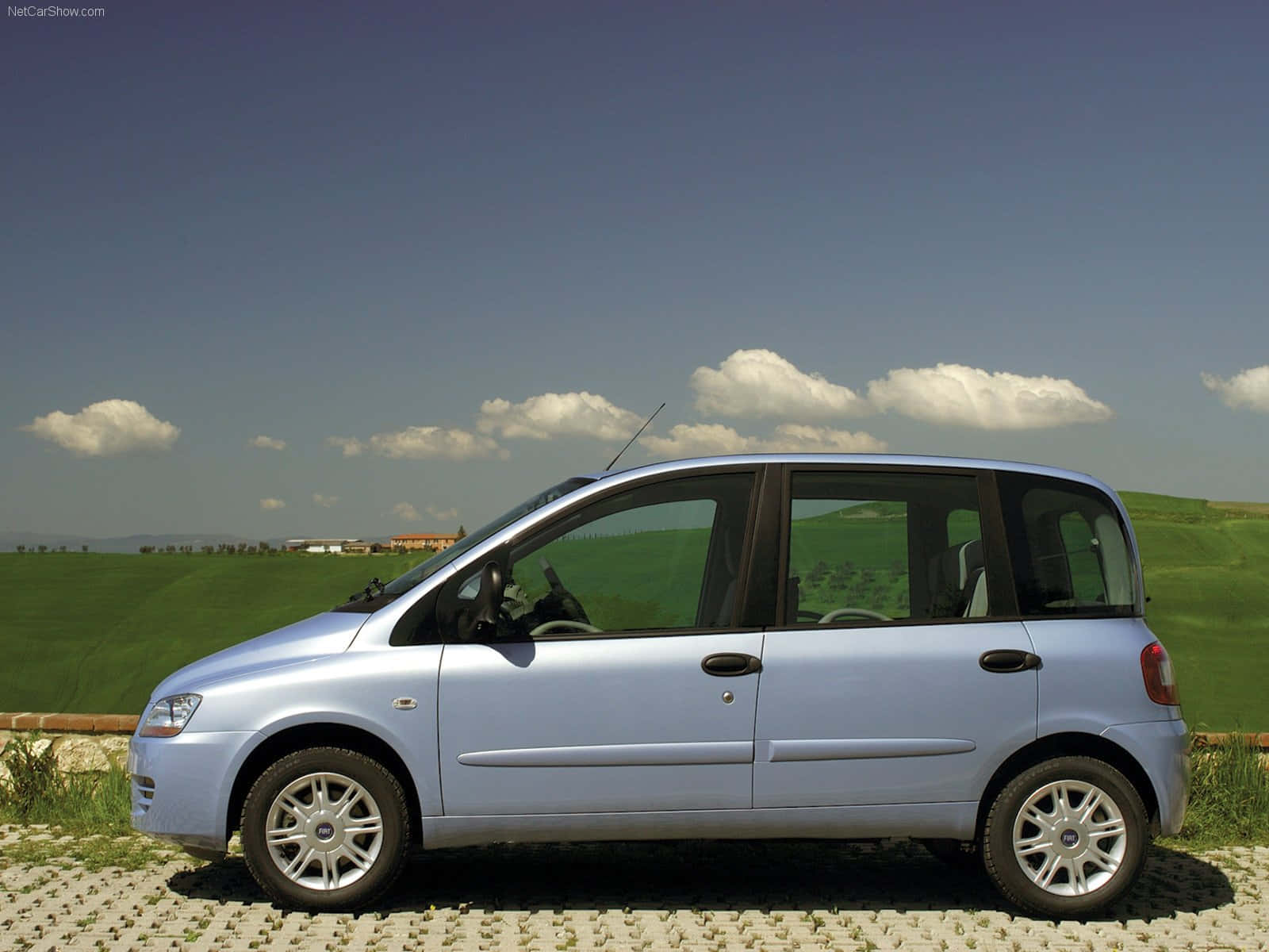 Elegant Fiat Multipla Showcasing Its Sleek Design On A Sunny Day Wallpaper