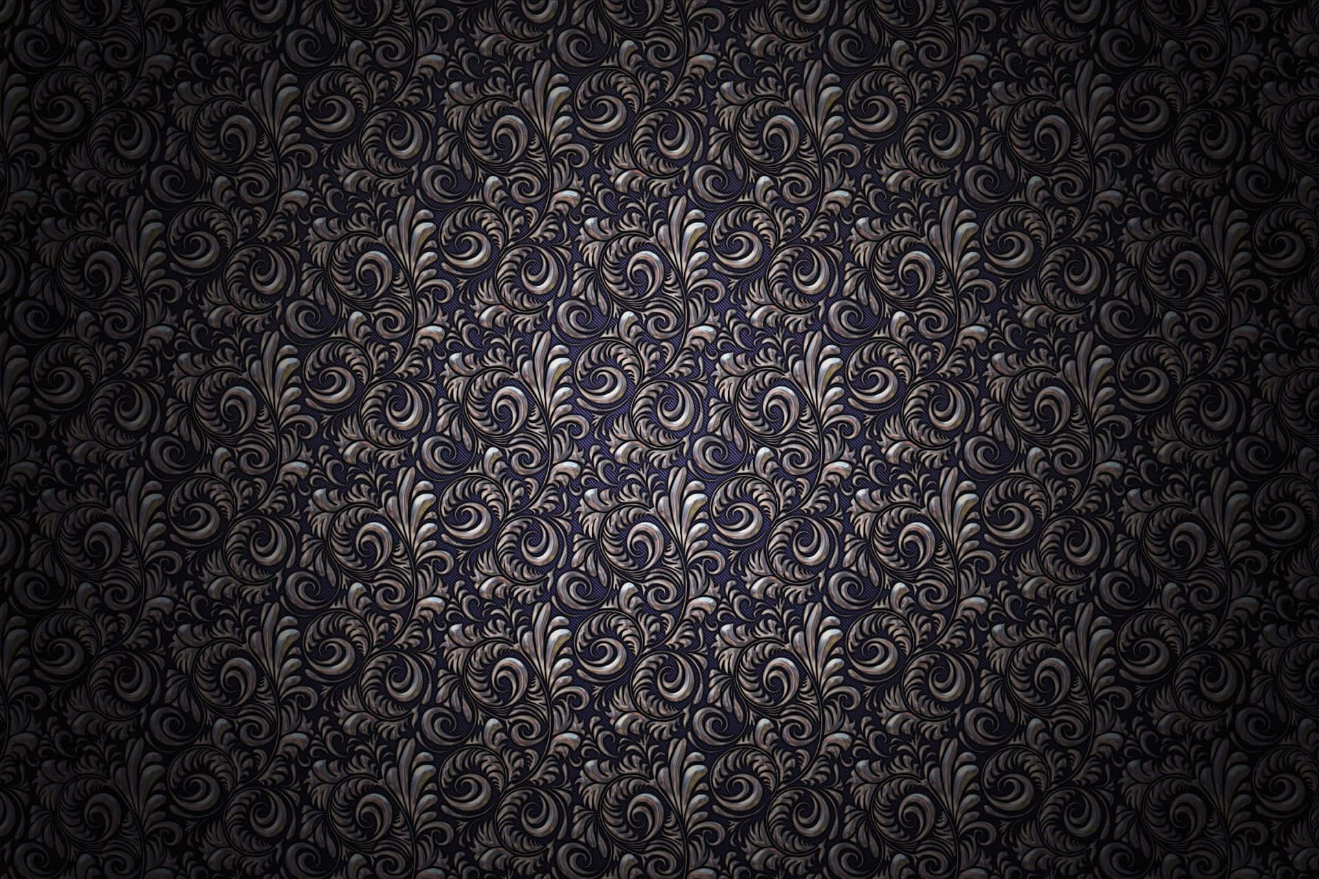 A Black And Silver Wallpaper With Swirls Wallpaper