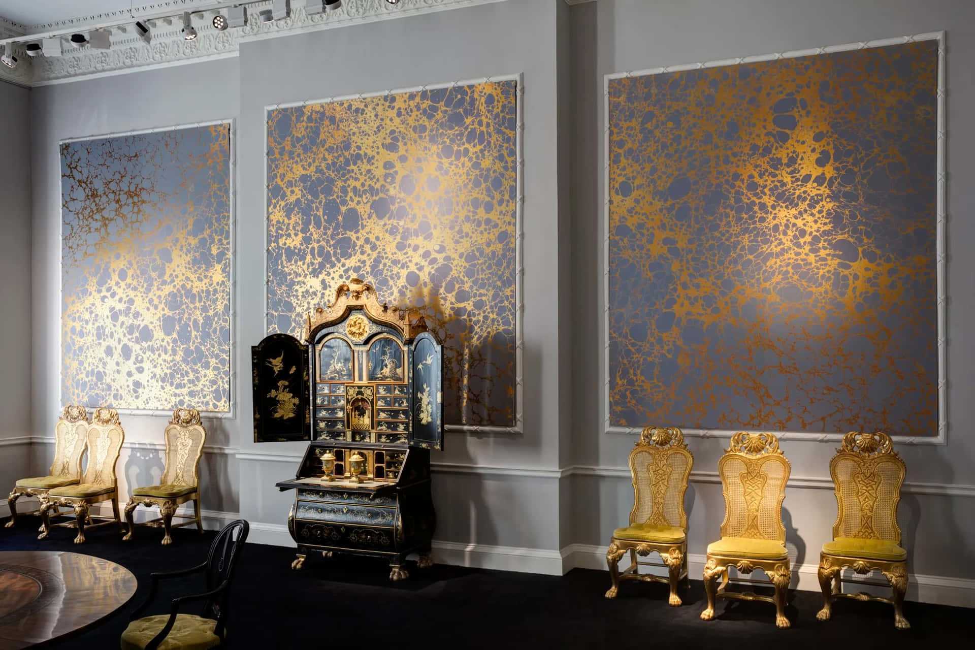 Elegant Interiorwith Golden Artwork Wallpaper
