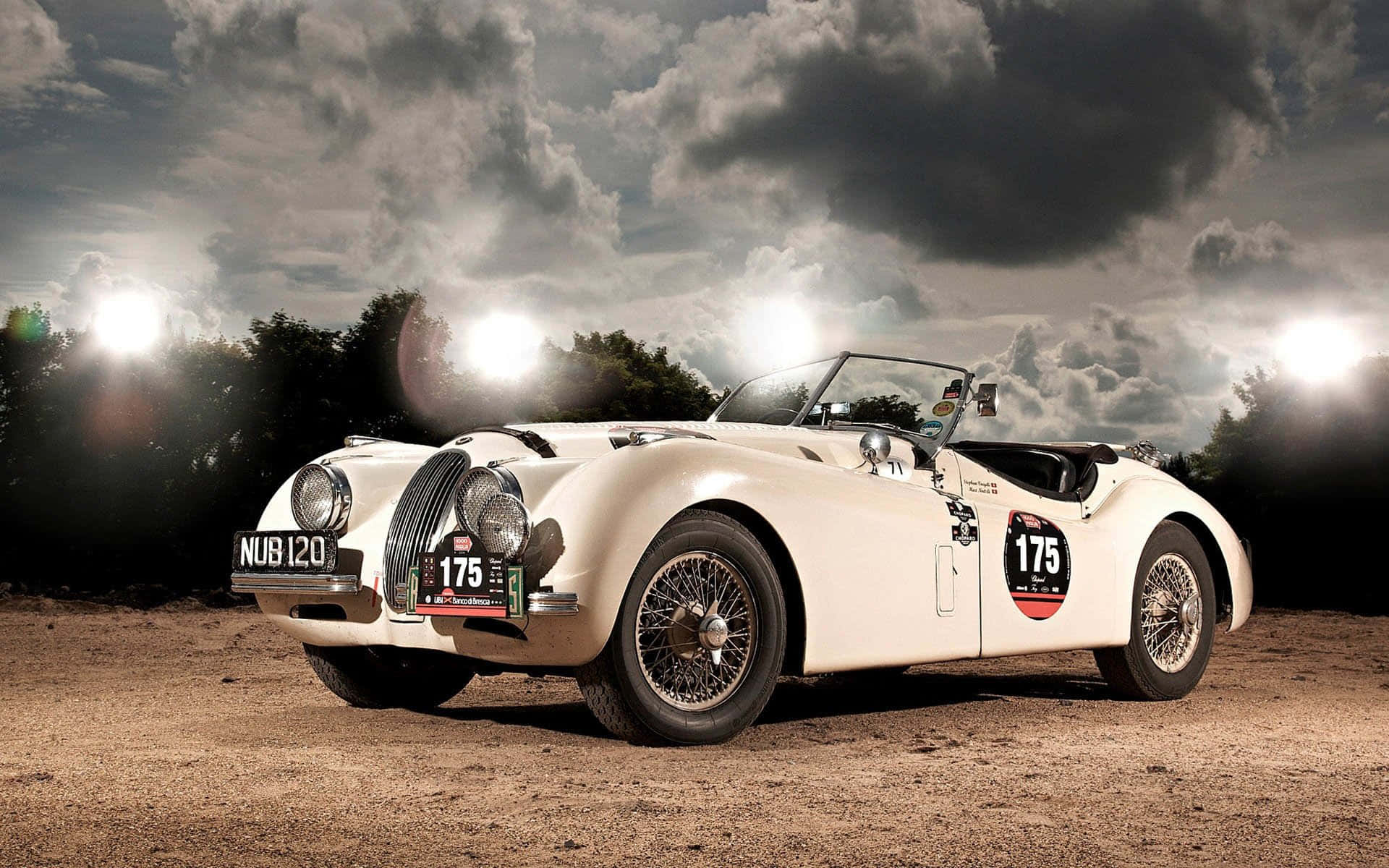 Elegant Jaguar Xk120 Gliding Through The Countryside Wallpaper