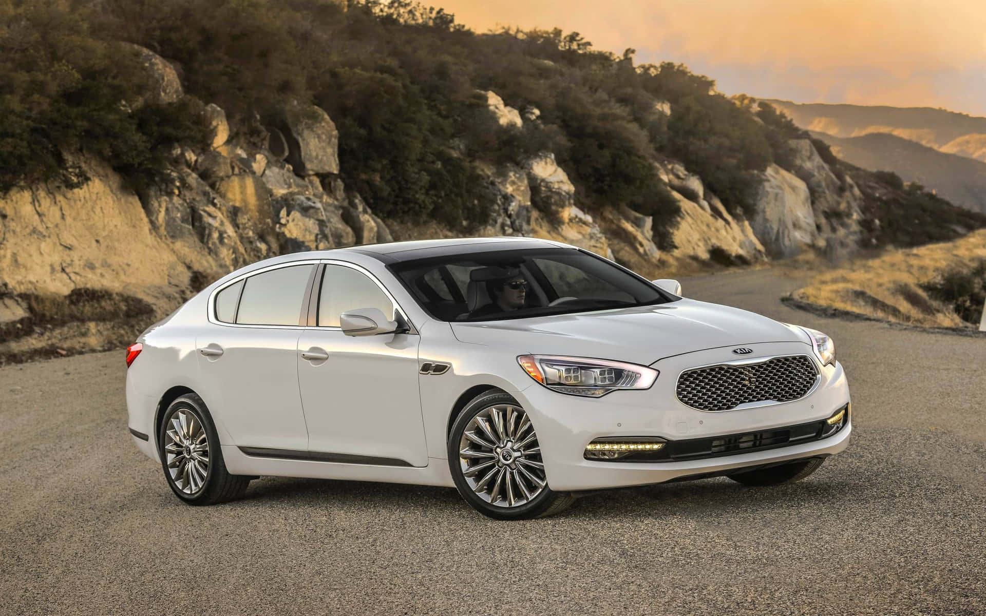 Elegant Kia K900 Luxury Sedan In Motion Wallpaper