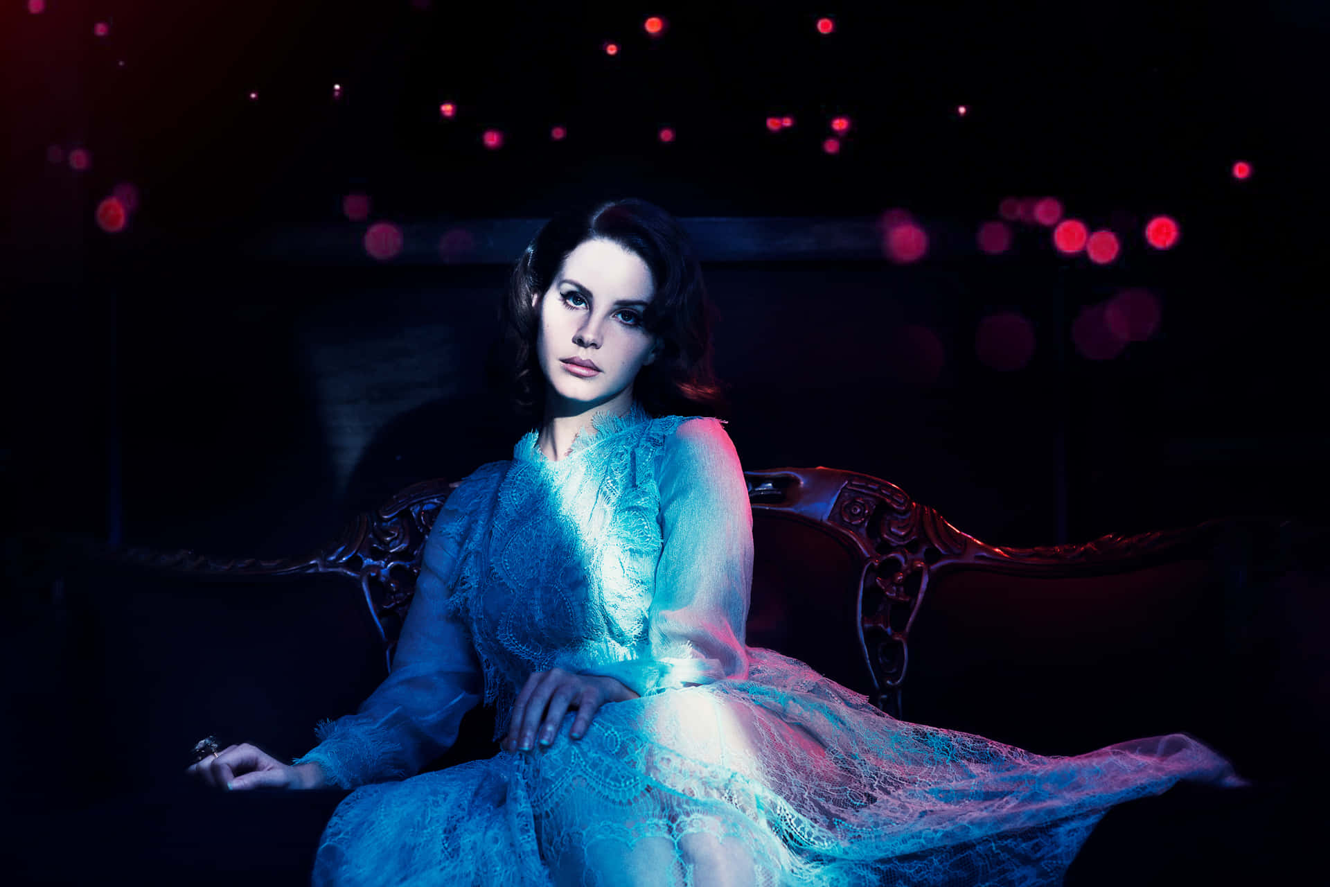 Elegant Lana Del Rey In Classic Black Attire Wallpaper