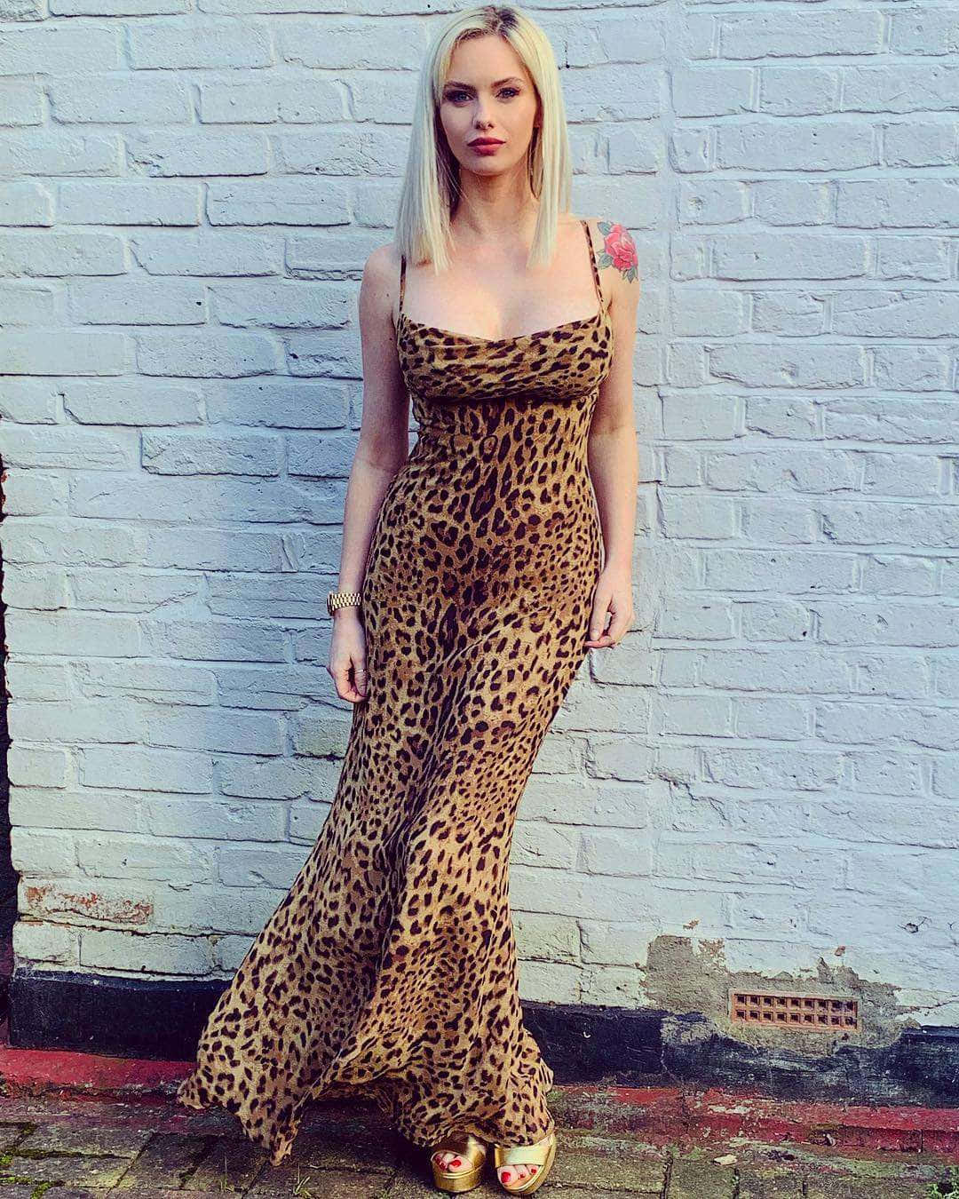 Elegant Leopard Print Gown Woman Wallpaper