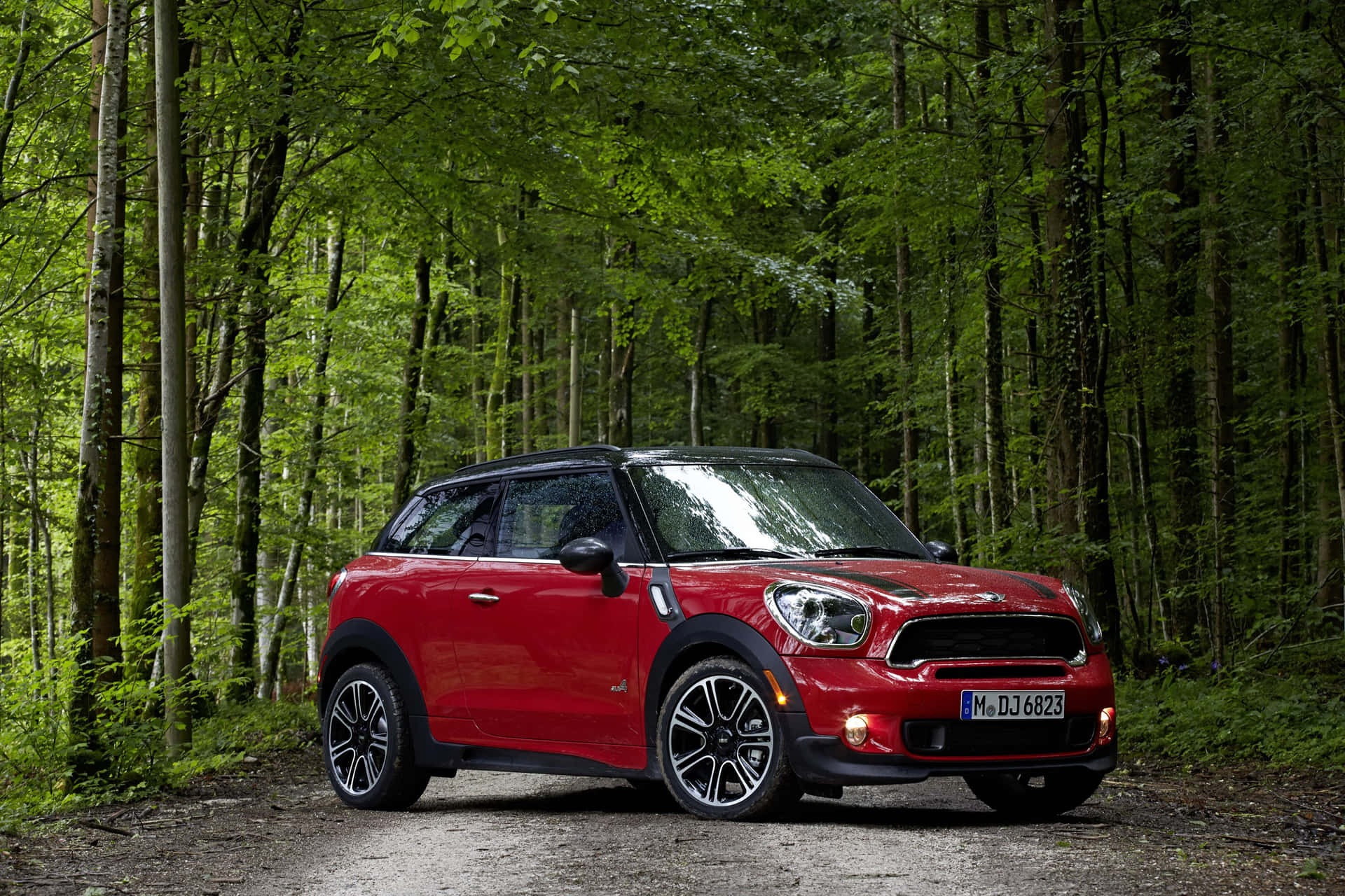 Elegant Mini Paceman Under Dramatic Cloudy Sky Wallpaper