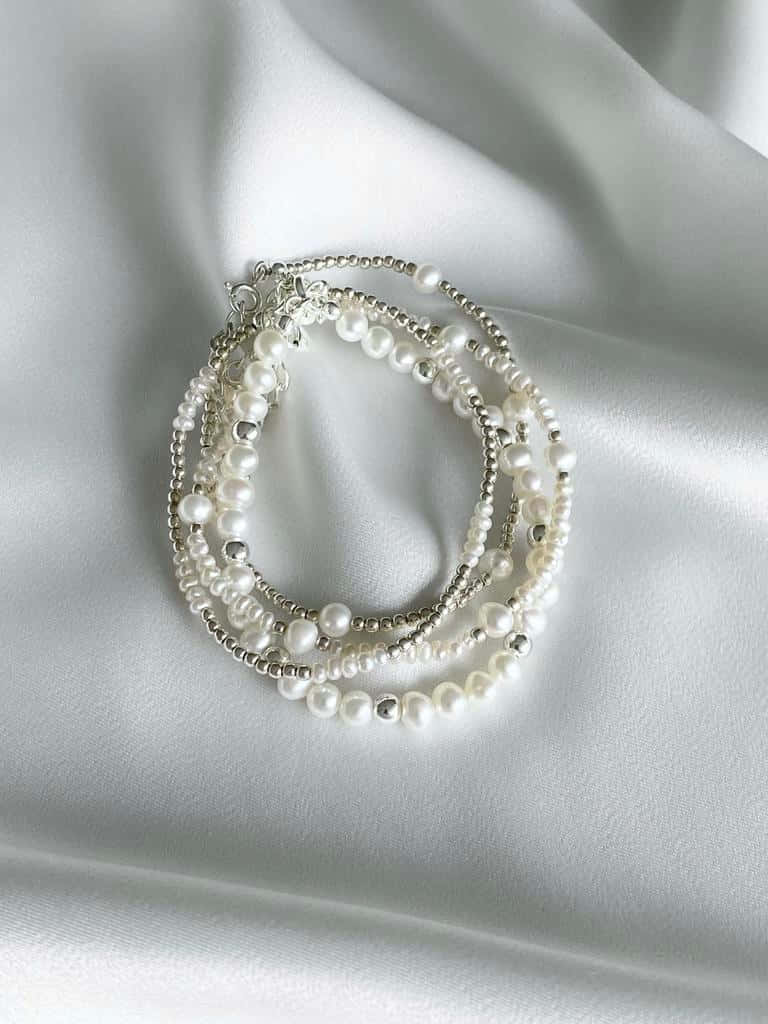 Elegant Pearl Necklace Display Wallpaper