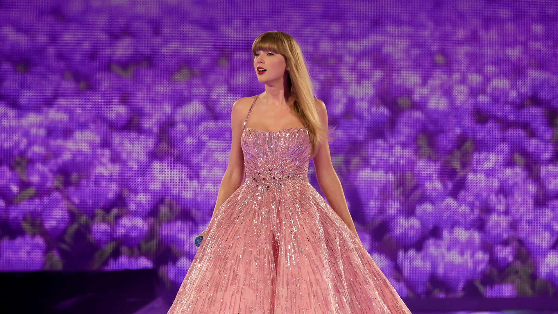 Elegant Performancein Pink Gown Wallpaper