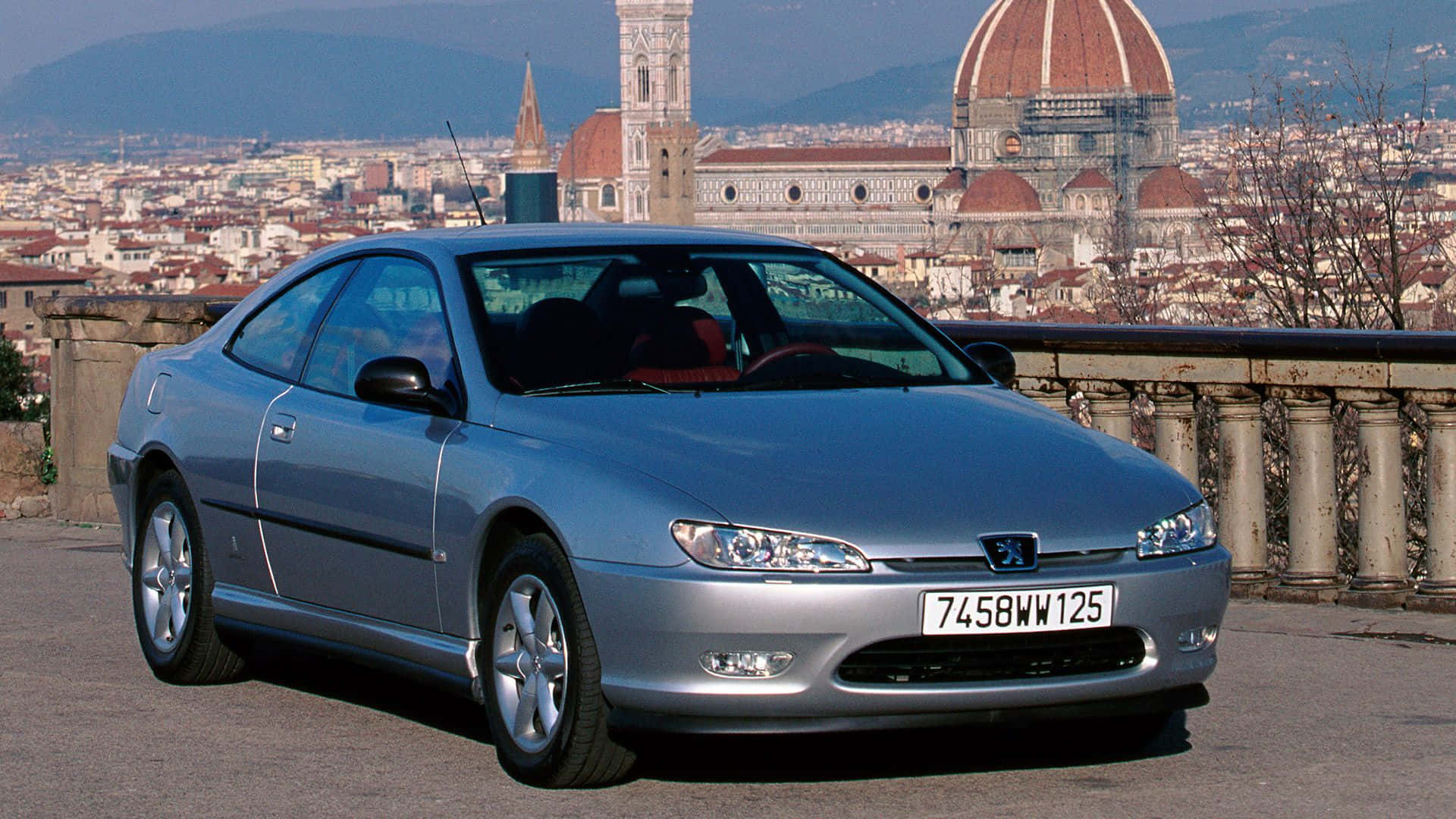 Elegant Peugeot 406 Cruising On A Serene Country Road Wallpaper