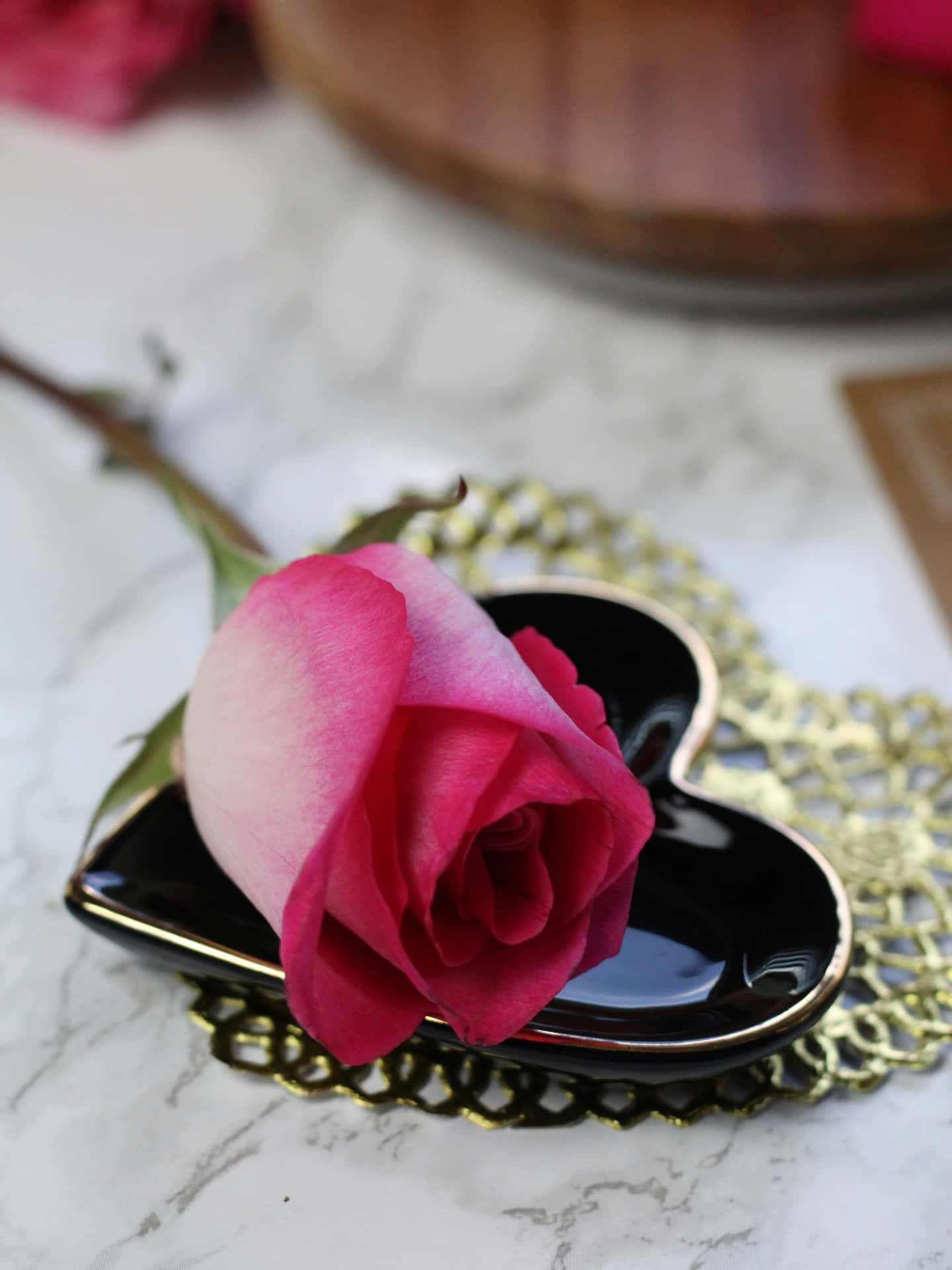 Elegant Pink Roseon Heart Plate Wallpaper