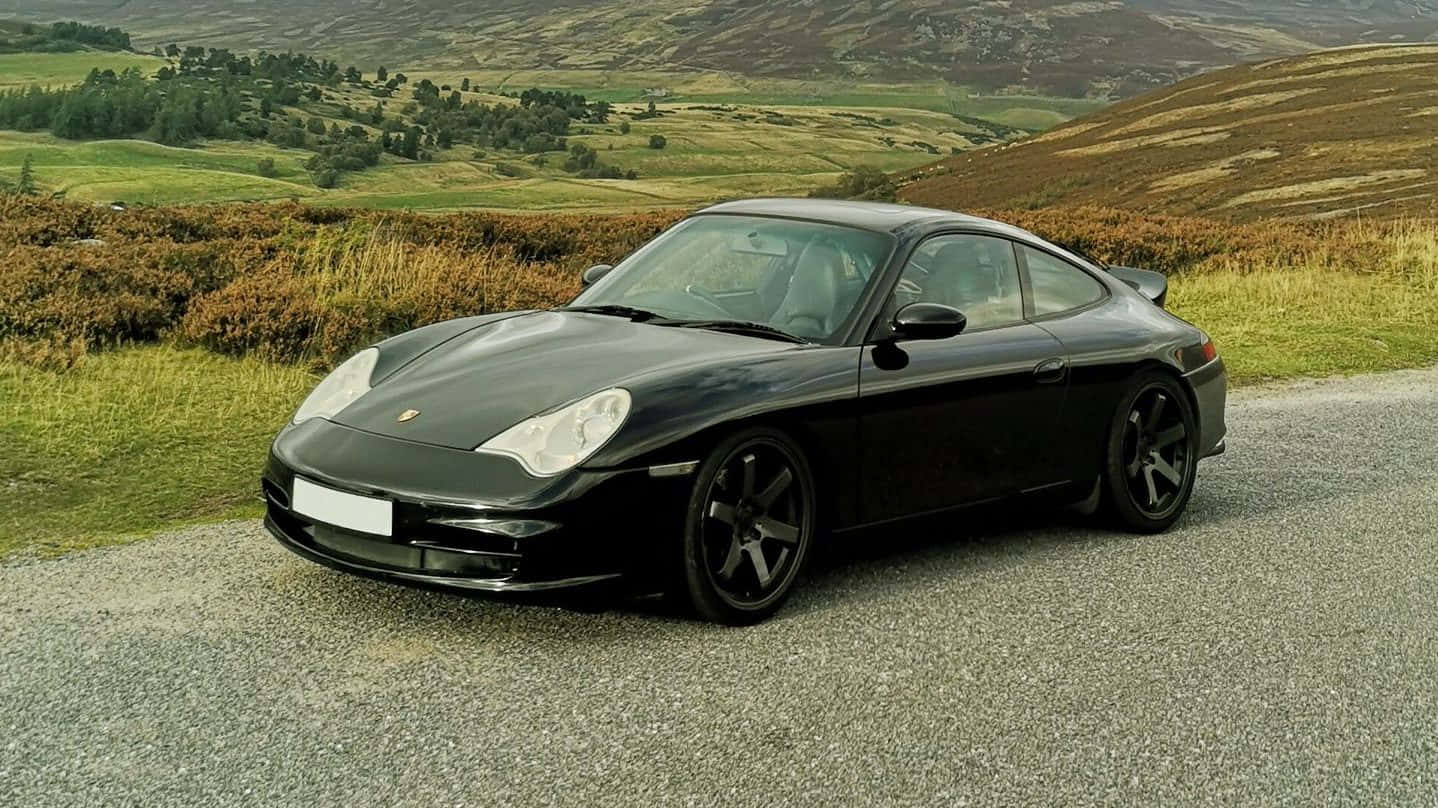 Elegant Porsche 996 Gliding On Road Wallpaper