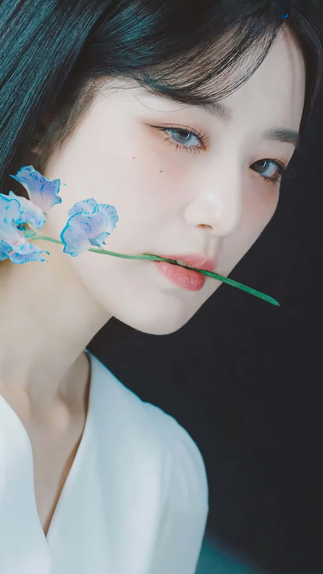 Elegant Portraitwith Blue Flowers Wallpaper