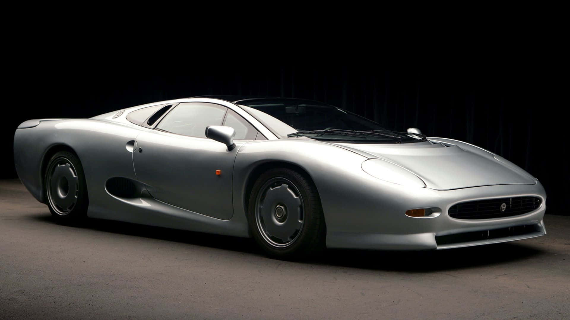 Download Elegant, Powerful, Jaguar Xj220 Wallpaper | Wallpapers.com