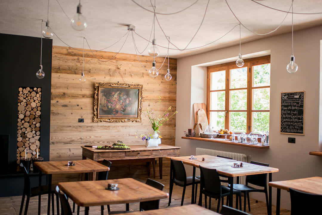 A Restaurant With Wooden Walls And Wooden Tables