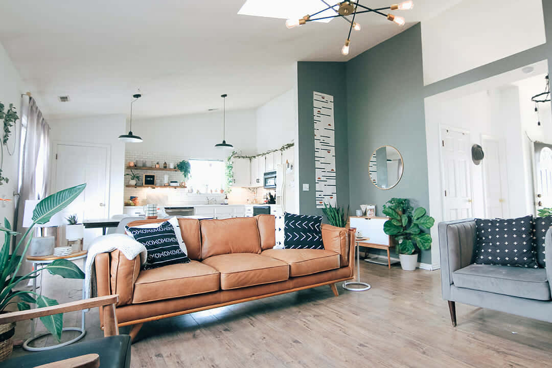 A Living Room With A Couch, Chairs And A Fireplace