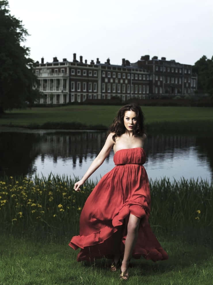 Elegant Red Dress Lakeside Photoshoot Wallpaper