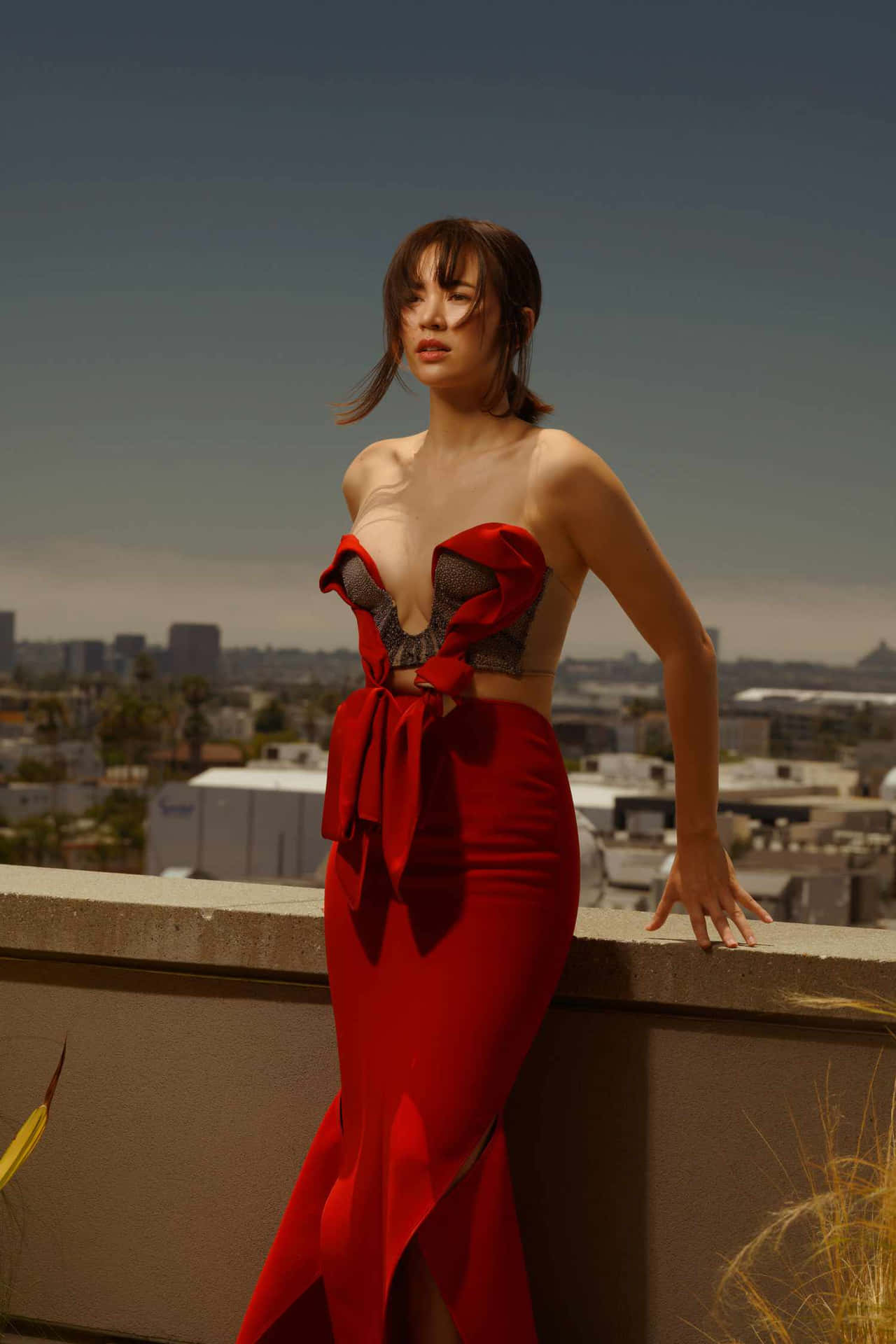 Elegant Red Dress Rooftop Photoshoot Wallpaper