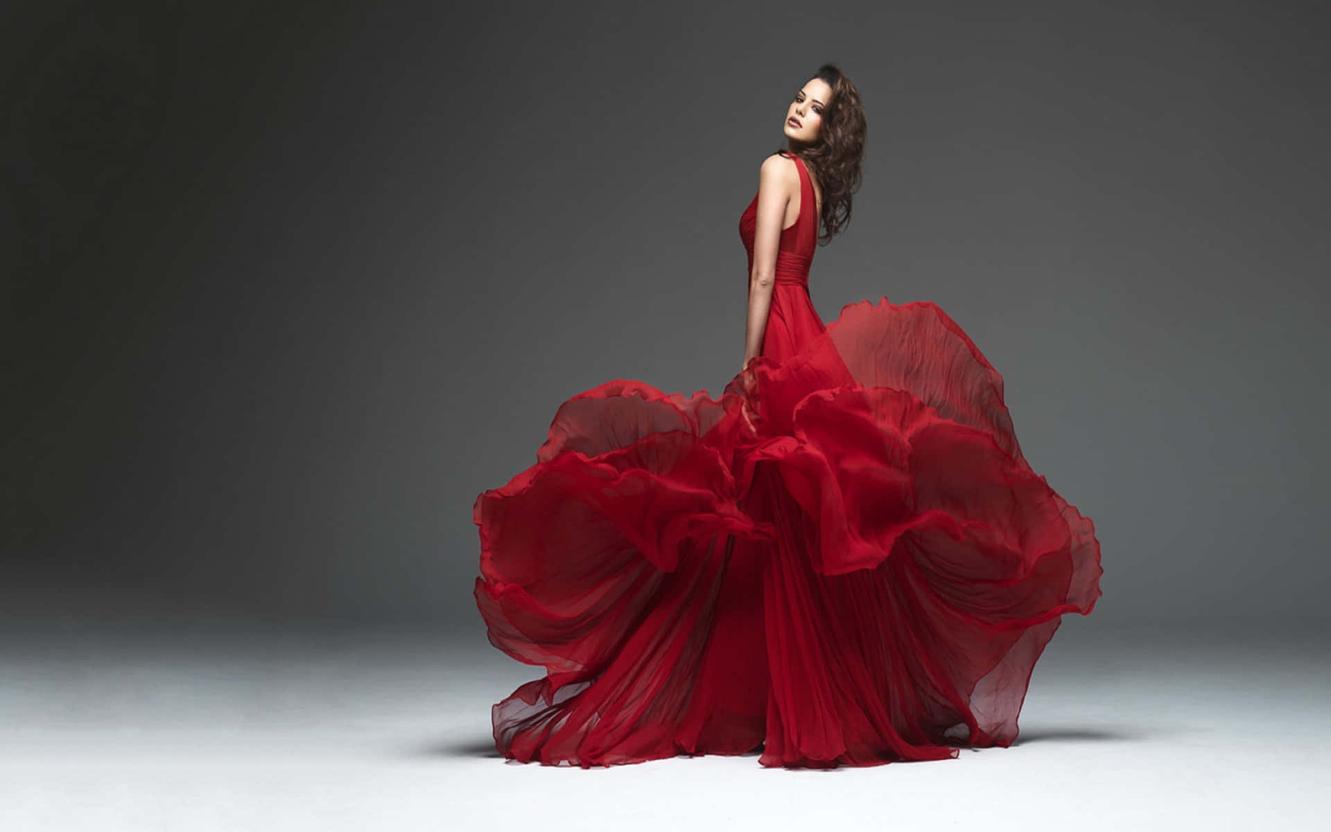 Elegant Red Gown Flowing Fabric Wallpaper