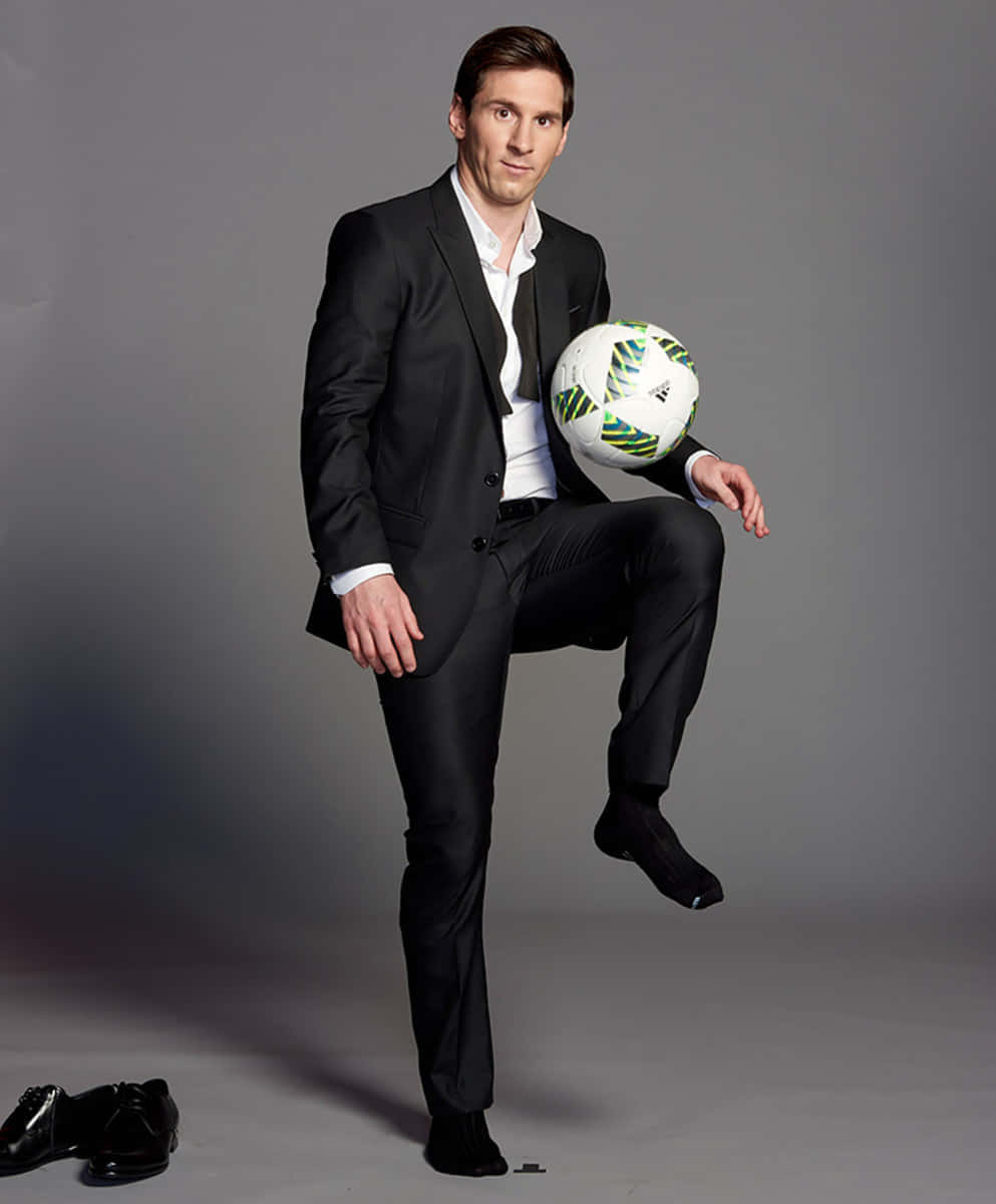 Elegant Soccer Player Suitand Ball Wallpaper